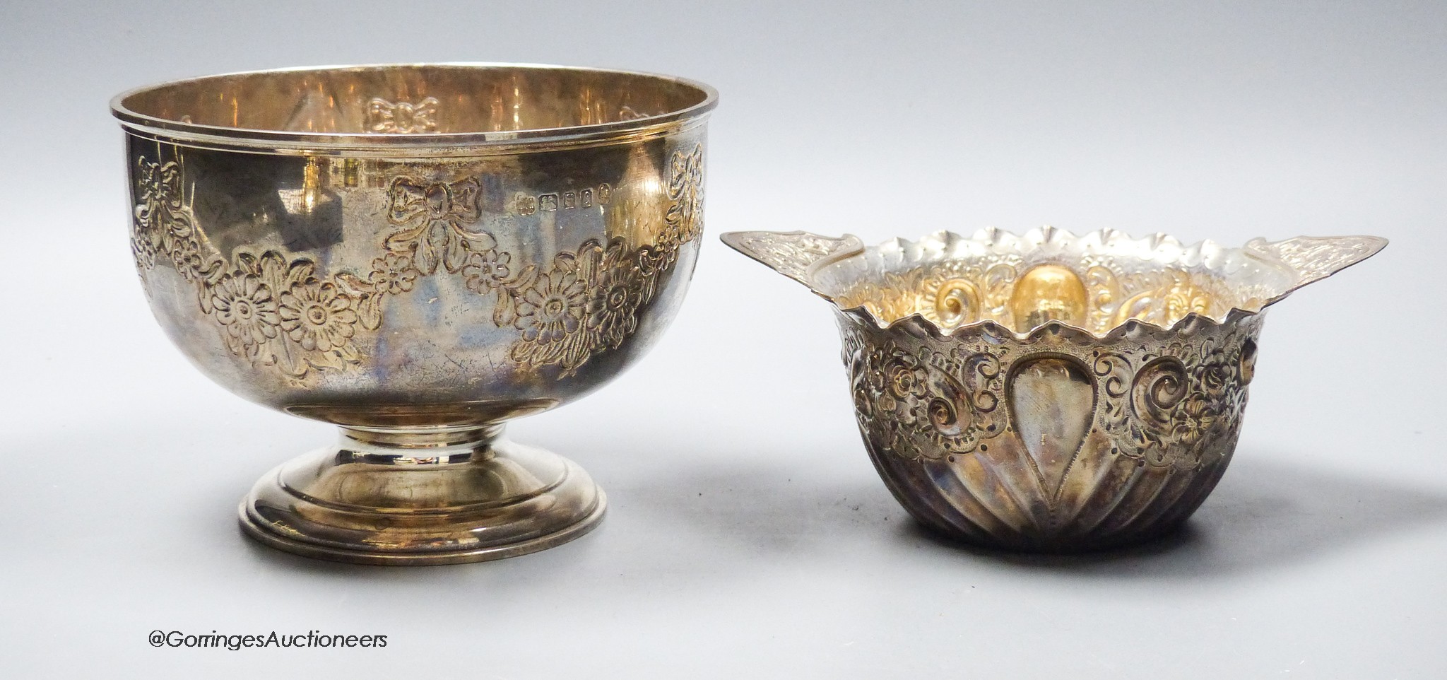 A late Victorian repousse silver two handled bowl, London, 1894, 16.8cm and a modern silver rose bowl, 14.5oz.